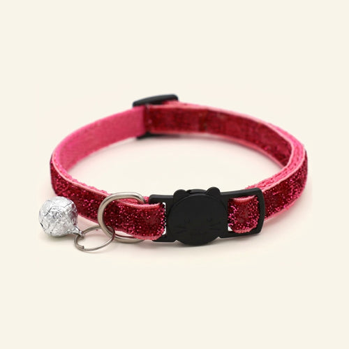 Glittery pink cat collar with a black cat-shaped buckle and a silver bell