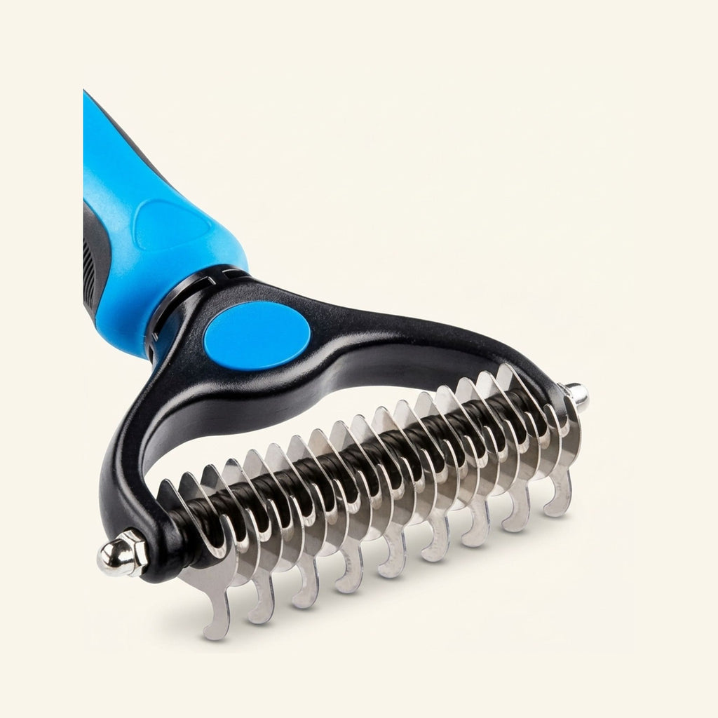 A blue and black double-sided dematting and deshedding brush with curved stainless steel teeth.